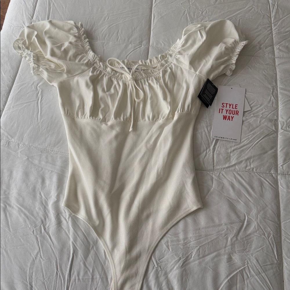 Celebrity Pink Cream Ruffled Off-Shoulder Bodysuit